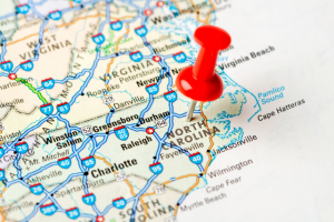 map of north carolina with a red pin